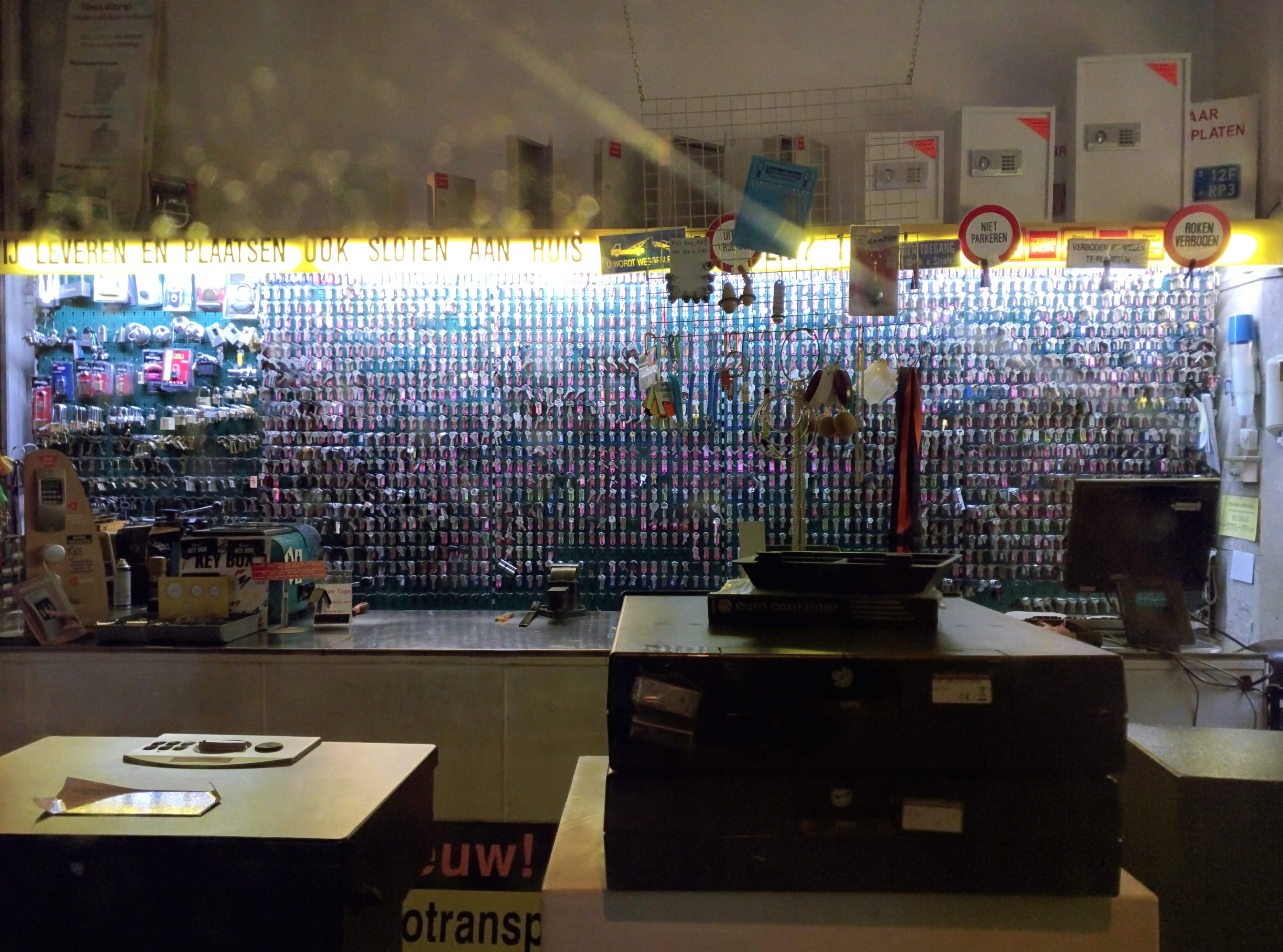 A photograph of a shop in Amsterdam that makes and sells keys. It's a wall full of them.